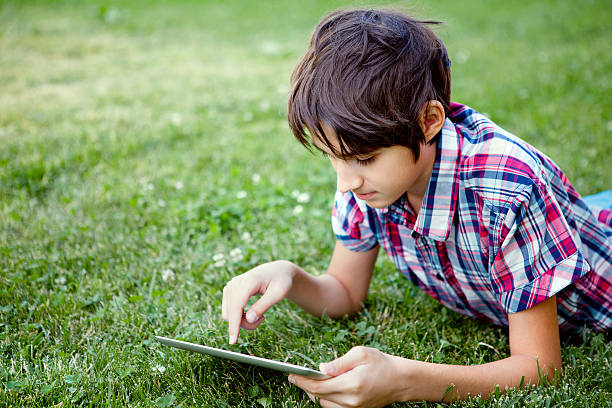 istock Teen uses digital tablet 490733509