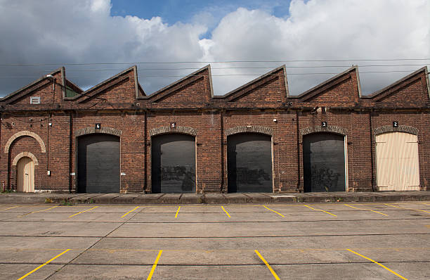 Old traditional factory building main facade with big gates