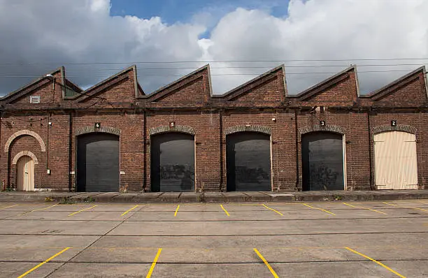 Old traditional factory building main facade with big gates