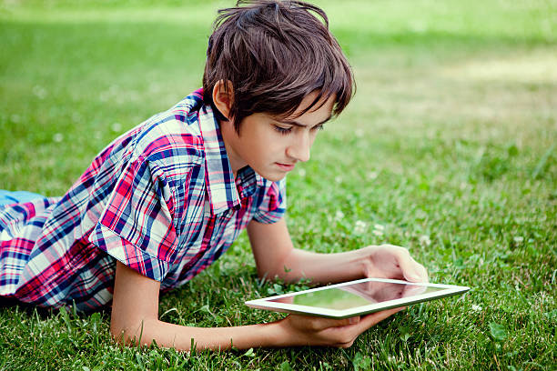 istock Teen uses digital tablet 490734351