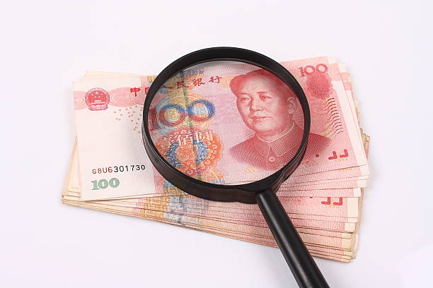 istock Chinese money and the magnifier 490734695