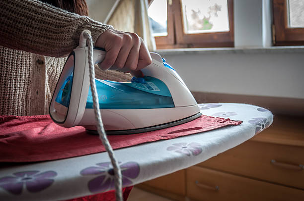 istock Woman ironing clothes 490734937