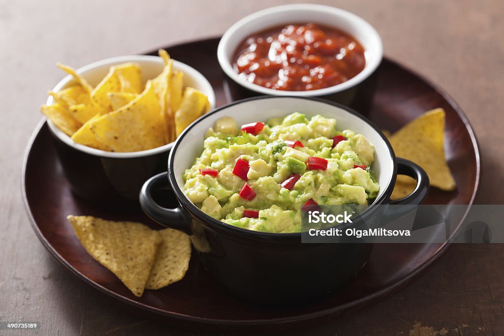 guacamole with avocado, lime, chili and tortilla chips Appetizer Stock Photo