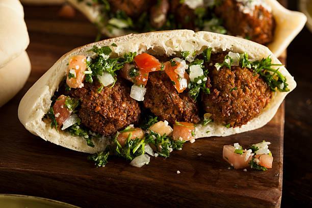 Healthy Vegetarian Falafel Pita Healthy Vegetarian Falafel Pita with Rice and Salad pita bread stock pictures, royalty-free photos & images