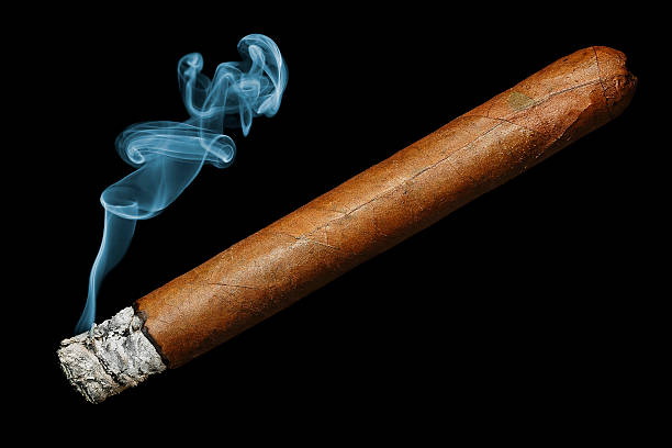 cigar cigar with smoke isolated on black background cigar photos stock pictures, royalty-free photos & images