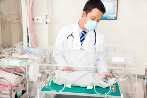 doctor examine a infant fake body situation in a baby room