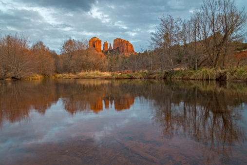 Winter scene of Cathedral Rock , Sedona with a Reflection in Oak Creek