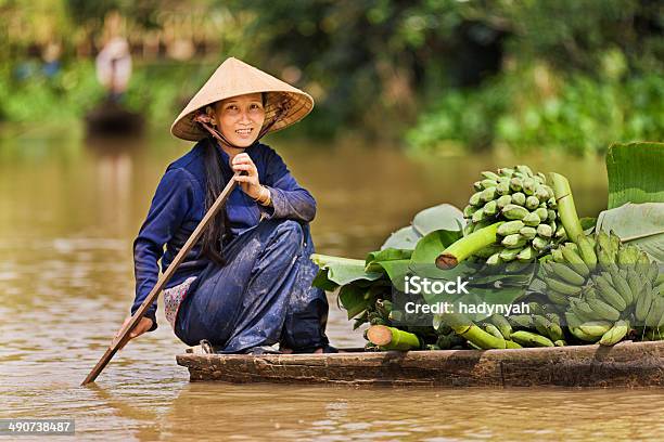 Vietnamese Woman Rowing Boat In The Mekong River Delta Vietnam Stock Photo - Download Image Now