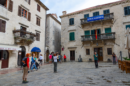 Kotor, Montenegro - September 21, 2015: Unknown tourists are near Maritime Museum on Square of Old Town, Kotor, Montenegro
