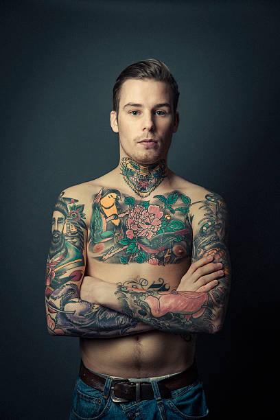 istock Shirtless tattooed man with arms crossed 490748954