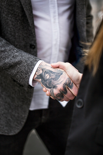 Professional Shaking Hand With Tattooed Businessman Stock Photo - Download Image Now - iStock Professional Shaking Hand With Tattooed Businessman Stock Photo - Download Image Now - iStock