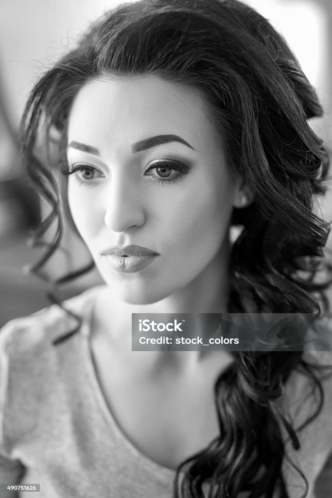 elegance and beauty black and white shot of beautiful woman portrait looking away, elegant curly hairstyle. 20-24 Years Stock Photo