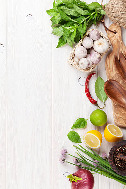 istock Fresh herbs and spices on wooden table 490753556
