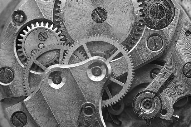 blanco y negro metálico cogwheels en antigua mecánica, macro. - watchmaking fotografías e imágenes de stock