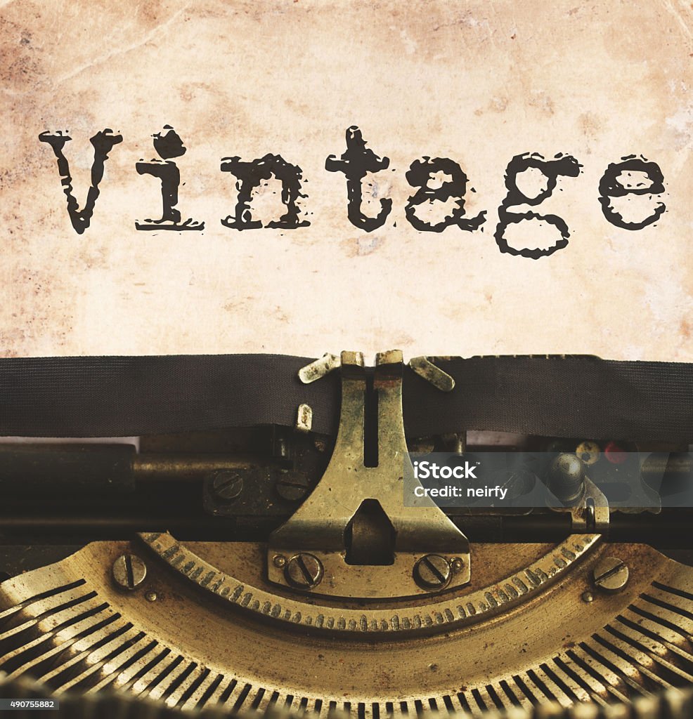 typewriter with blank page black vintage typewriter with word vintage, retro toned  2015 Stock Photo