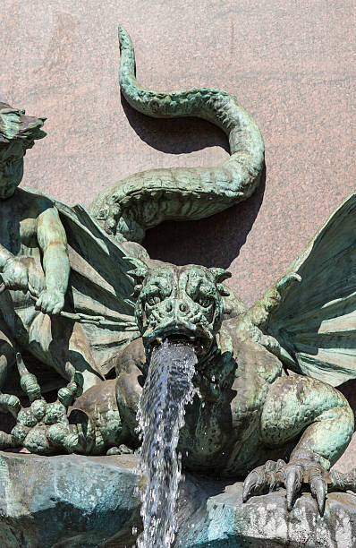 istock Dragon gargoyle on classical fountain 490758378