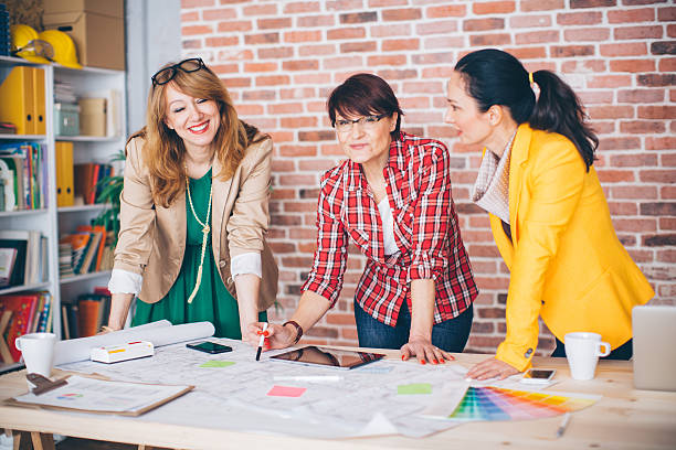 istock Three mature woman working in office. 490759044