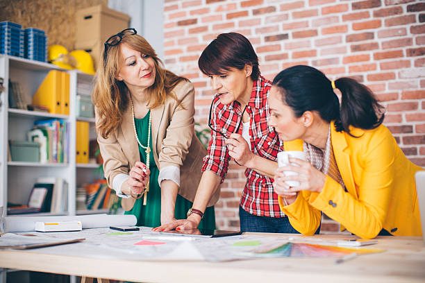istock Three mature woman working in office. 490759216