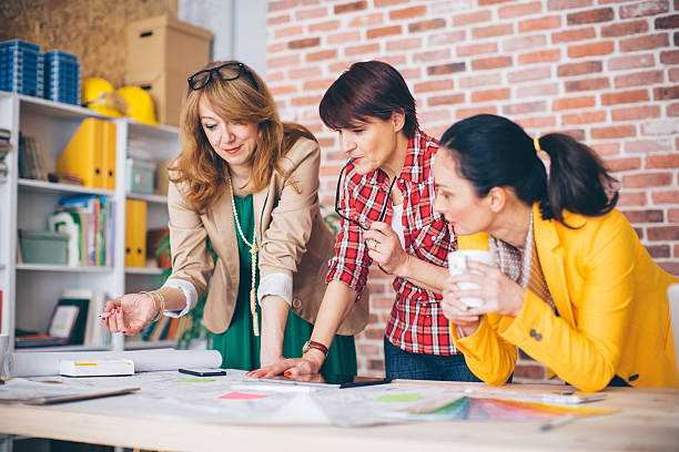 istock Three mature woman working in office. 490759488