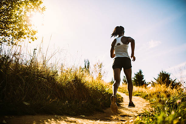 istock Woman Running in Beautiful Nature Setting 490760174