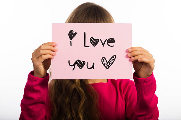 istock Child holding I Love You sign 490760184