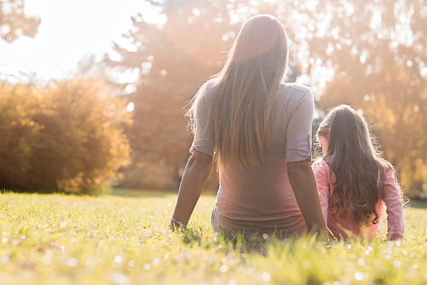 istock mom and daughter trned back to camera 490760520