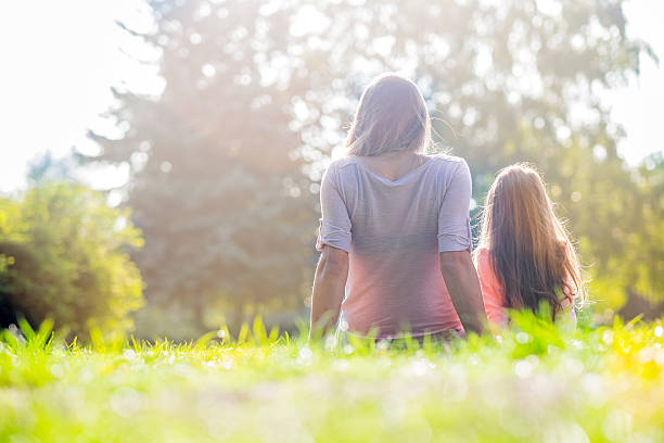 istock mom and daughter are looking a way 490760676