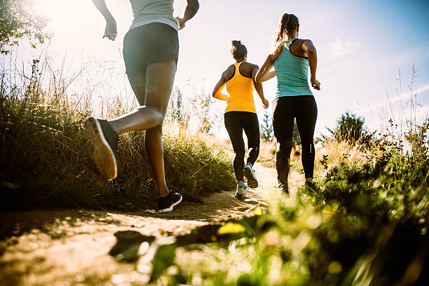 istock Group of Women Running Dirt Trail 490760934