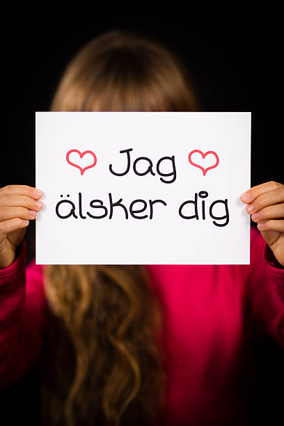 istock Child holding sign with Swedish words Jag Alsker Dig 490761126