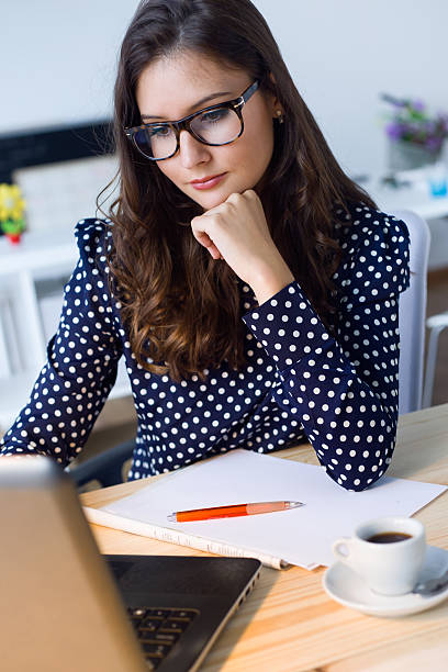 istock Beautiful young woman working with laptop in her office. 490761514