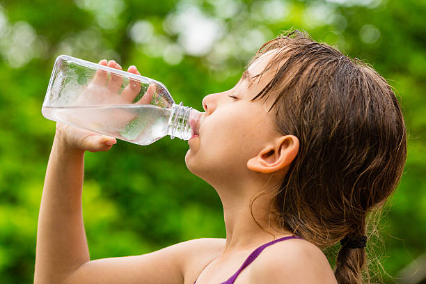 istock Child drinking clean tap water from transparent plastic bottle 490761568