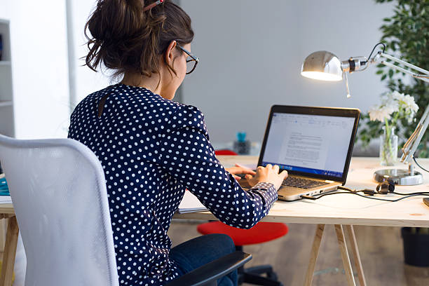 istock Beautiful young woman working with laptop in her office. 490762684