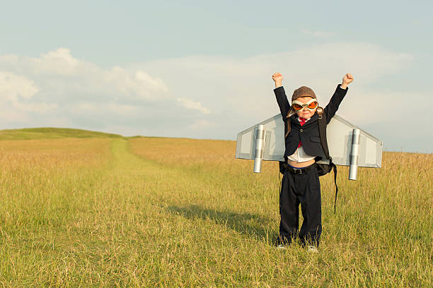 istock Young Boy Businessman Wearing Jetpack in England 490772110