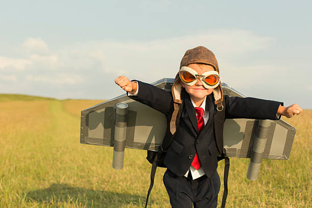 молодой мальчик бизнесмен в «реактивный ранец» в англии - creativity inspiration humor business стоковые фото и изображения
