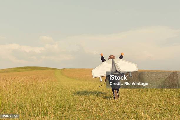Young Business Boy Wearing Jetpack In England Stock Photo - Download Image Now - Child, Aspirations, Creativity