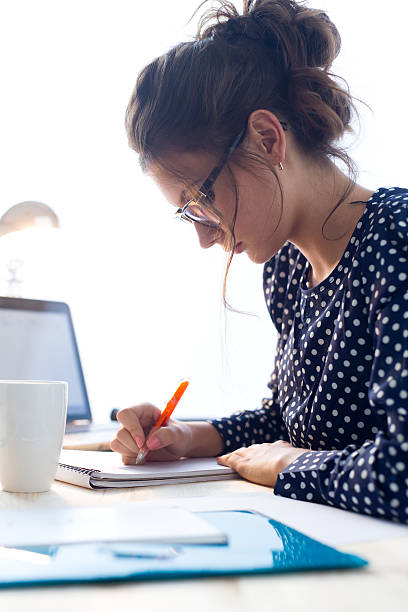 istock Beautiful young woman working in her office. 490772482