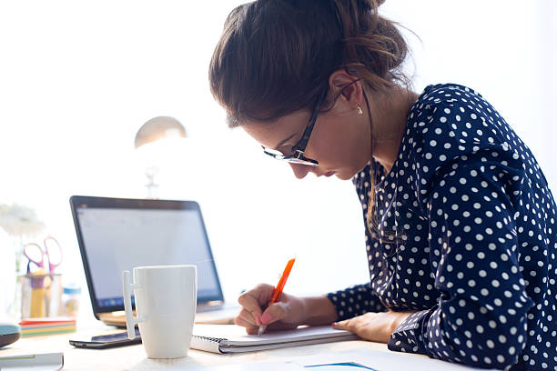 istock Beautiful young woman working in her office. 490772612