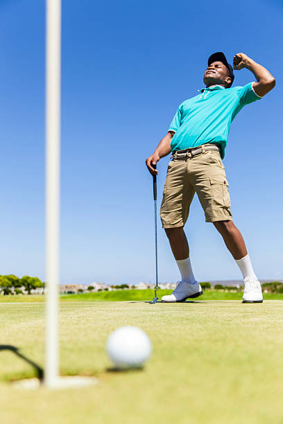 istock African golfer just misses his putt 490772721