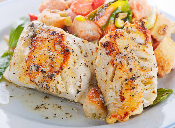 Mahi Mahi Fillets with Salad Seared Mahi Mahi Fillets with Vegetables and Sauce tropical fish closeup stock pictures, royalty-free photos & images
