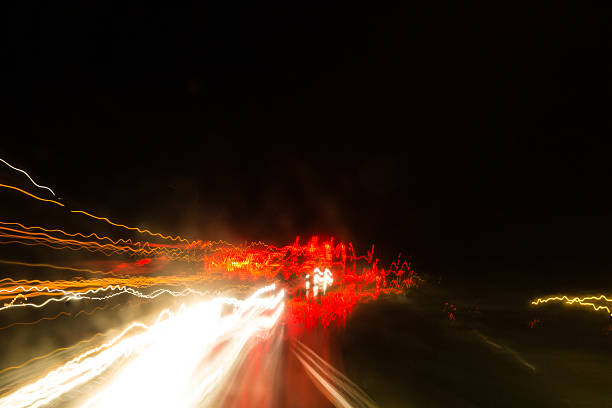 istock traffic traces in the rainy night 490774422