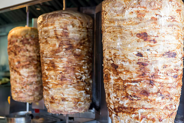 istock rotating skewered chicken and lamb meat grilled 490775674