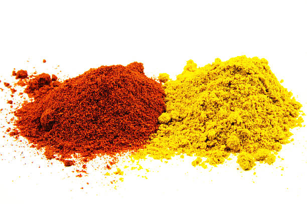 istock Red pepper and curry spice isolated on white background 490775963