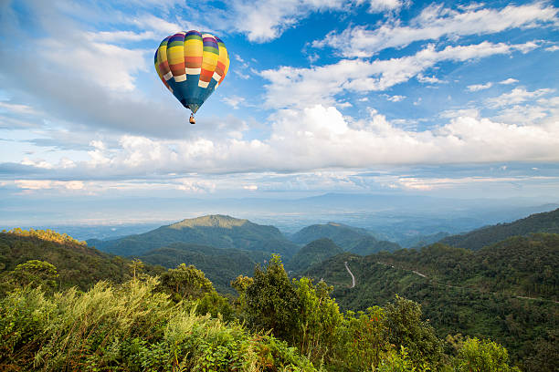 istock Hot air balloon over the mountain 490777119