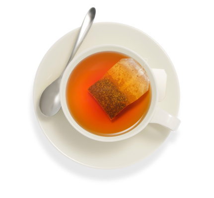 Top view of a cup of tea with tea bag, isolate on white