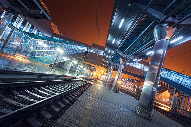 istock Railway station at night. Train platform in fog. Railroad 490777672