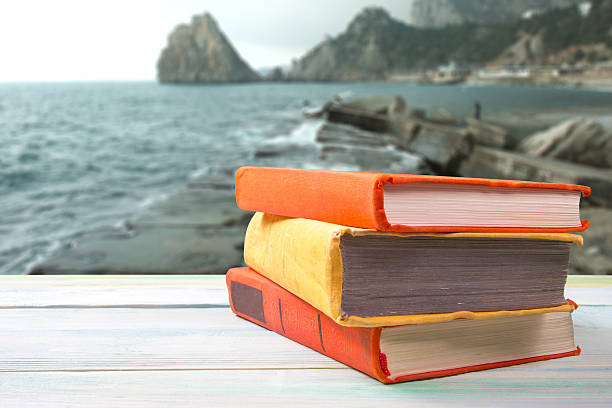 istock Stack of colorful books on wooden table 490777954