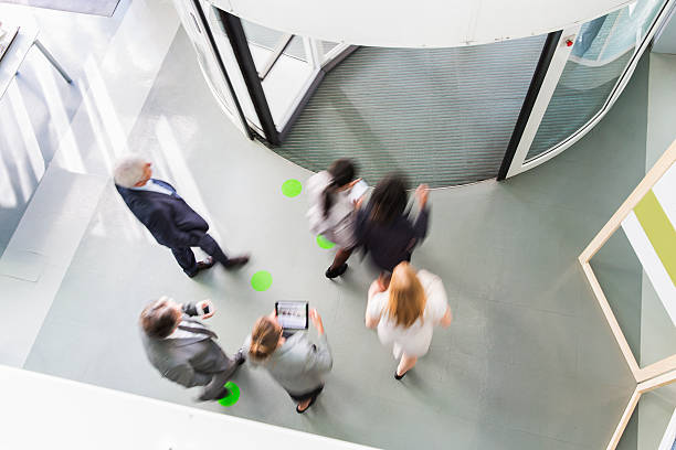 istock Group of ofiice worker entering through revolving door 490779560