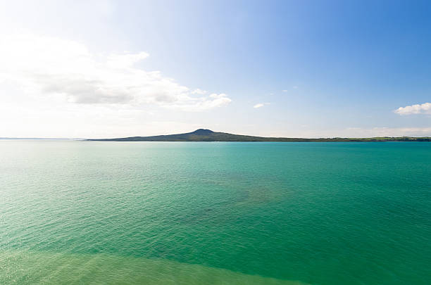 Rangitoto Island view from Mission Bay in Auckland,New Zealand. stock photo
