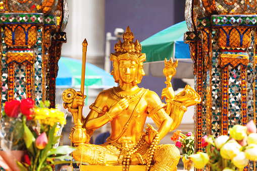 Three headed golden famous statue of Erawan shrine in Bangkok