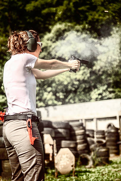 istock Woman pointing a gun 490781686